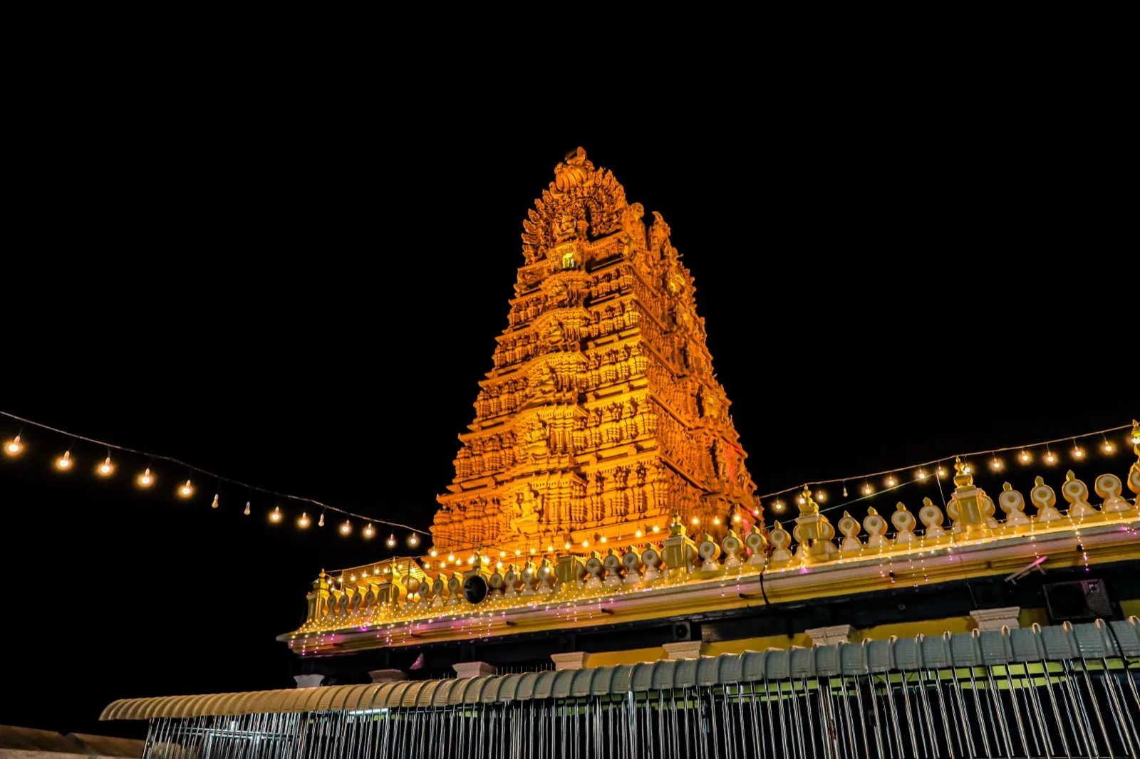 Seven-storey gopuram of Sri Chamundeshwari Devi Temple against a blue sky